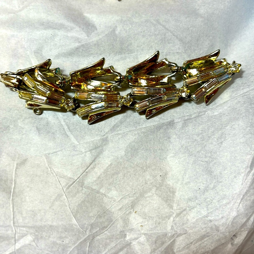 Gold costume jewelry bracelet with gems